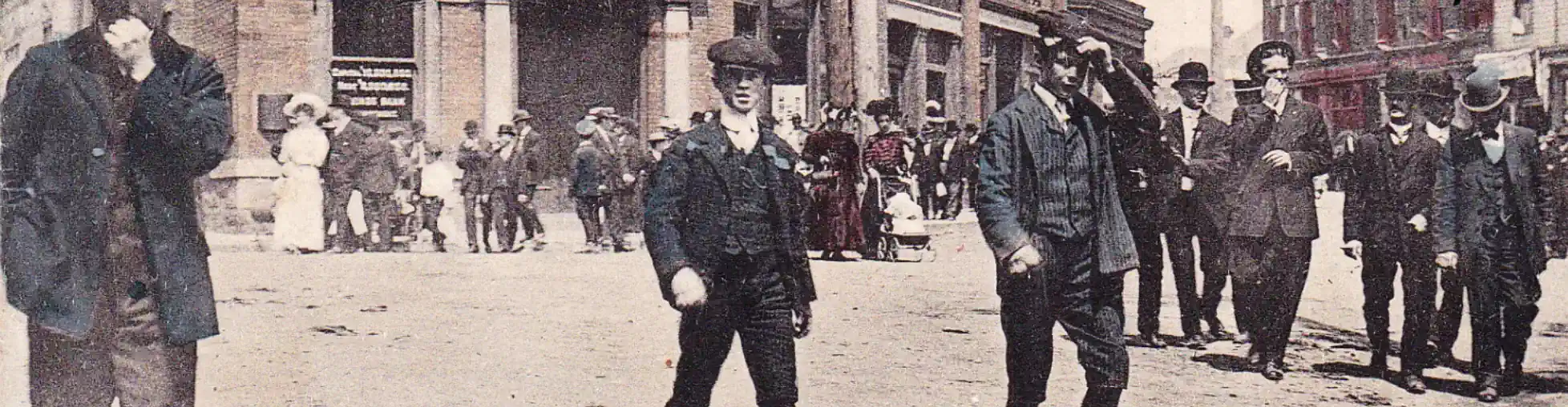 Old 1913 postcard image showing lads out on the town on Church St in Nanaimo