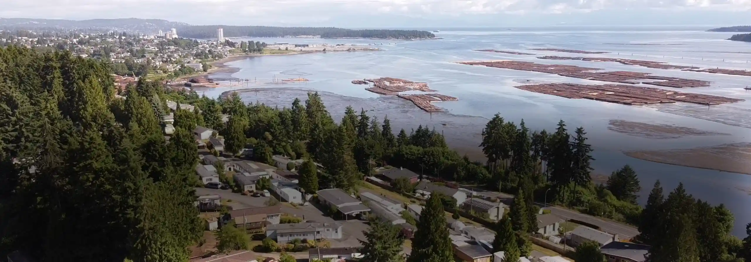 Aerial photo showing Nanaimo Harbour and downtown, with Petroglyph Manufactured Home Park in the foreground